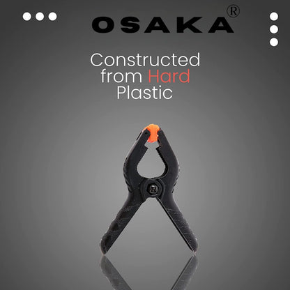 Black clamp with orange clip on a gray background, featuring the Osaka brand.