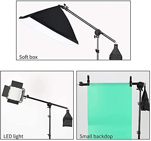 Photography studio equipment including a soft box, LED light, and a small backdrop 
